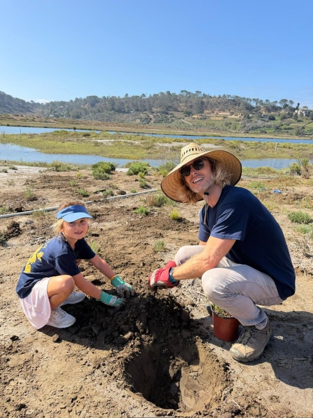 Local Pack 734 Scouts and their families volunteered during Coastal Cleanup Day at the San Dieguito Lagoon. (Courtesy I Love a Clean San Diego)