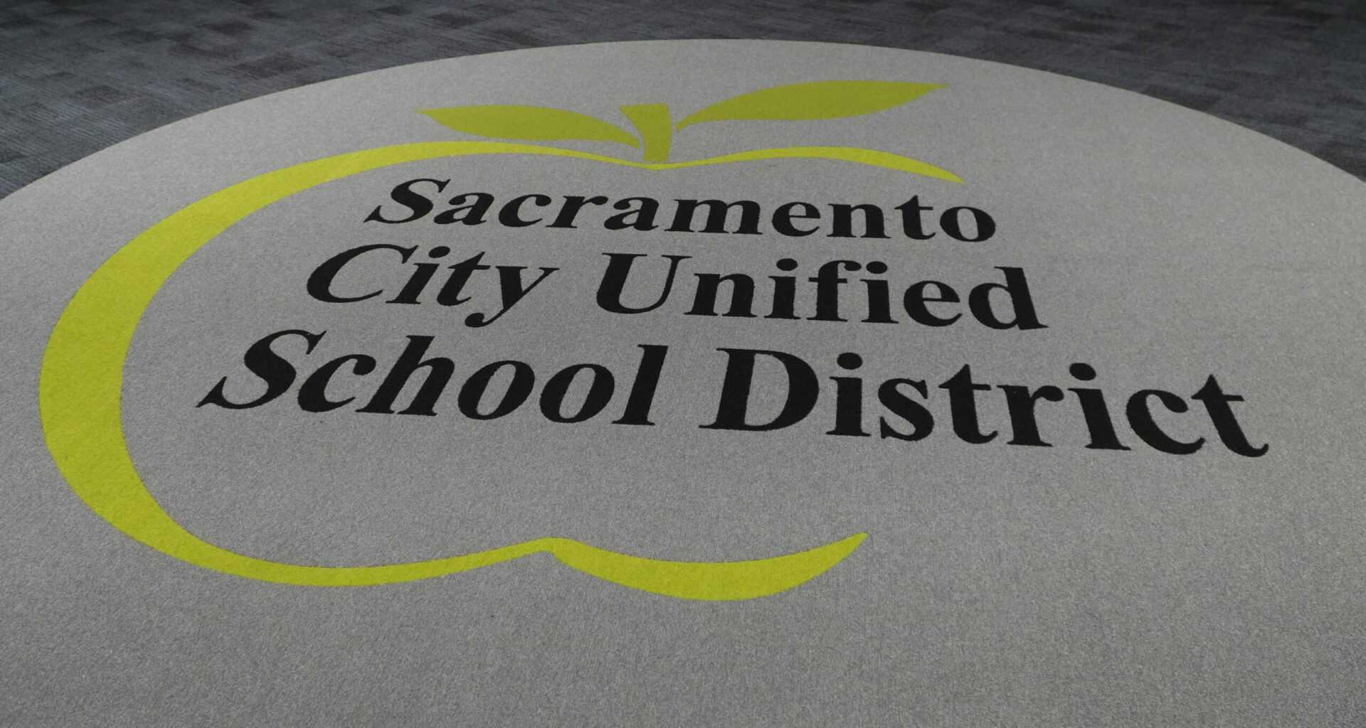 A rug with the Sacramento City Unified logo