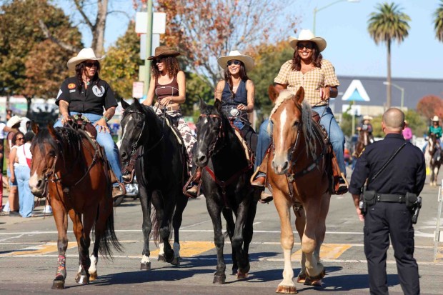 Women horseback ride while participating in the Oakland Black Cowboy Association's 52nd Annual Parade and Festival at DeFremery Park in Oakland, Calif., on Saturday, Oct. 3, 2026. The event brought the community together under the theme "Preserving Our Heritage, Inspiring Our Future," featuring live entertainment, line dancing, youth activities, pony rides, food, local vendors and community resources. (Ray Chavez/Bay Area News Group)