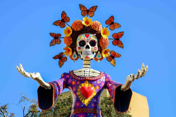 La Catrina, a monumental 34-foot sculpture handcrafted in Mexico City is installed in the heart of the Fruitvale district in Oakland, Calif., on Thursday, Oct. 1, 2026. According to The Unity Council, the traditional Mexican art piece is the tallest Catrina sculpture in the United States, honoring culture, pride, remembrance, resilience and generations of immigrants who empower and enrich the city. The ceremony featured speakers including Mayor Barbara Lee, Councilmember Noel Gallo, Consul General of Mexico in San Francisco Marco Antonio Mena Rodriguez, Unity Council President Chris Iglesias and Visit Oakland President Peter Gamez, along with dance performances and live mariachi music. The sculpture will be on display through the annual Día de los Muertos festival. (Ray Chavez/Bay Area News Group)