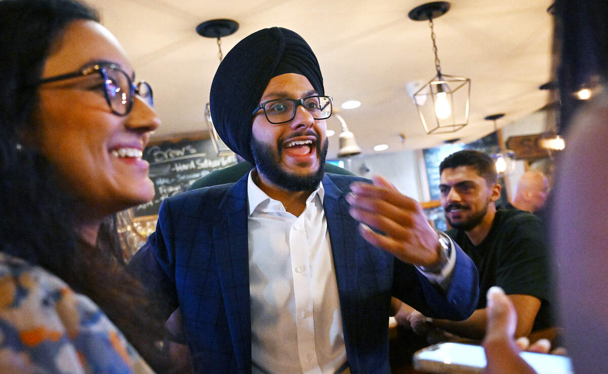 Fresno City Council District 7 candidate Nav Gurm, center, is seen during a campaign gathering at Sequoia Brewing in the Tower District Tuesday night, June 2, 2026, in Fresno.