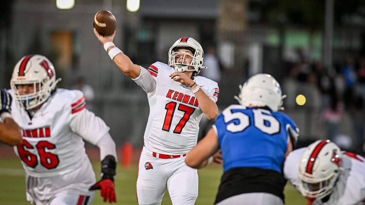 Kerman quarterback Peyton Coleman throws deep against the Madera defense in the first half of their game at Madera South Stadium in Madera on Friday, Sept. 4, 2026.