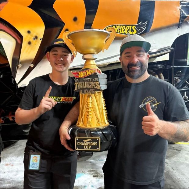 Mike Menter, right, with his son, Mason, of Rigby, Idaho, will drive Tiger Shark at "Hot Wheels Monster Trucks Live: Glow-N-Fire" this weekend. (Courtesy photo)
