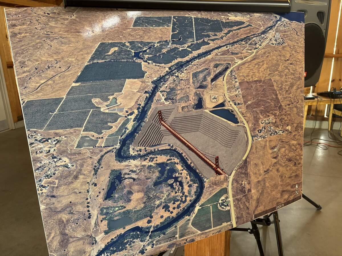 A photo composite rendering made by a retired architect of CEMEX’s proposed blast mine near the San Joaquin River and the Golden Gate Bridge, which critics of the project say could nearly fit in the proposed hole. The photo was on display Friday, Oct. 2, 2026, at the San Joaquin River Parkway and Conservation Trust’s River Center.
