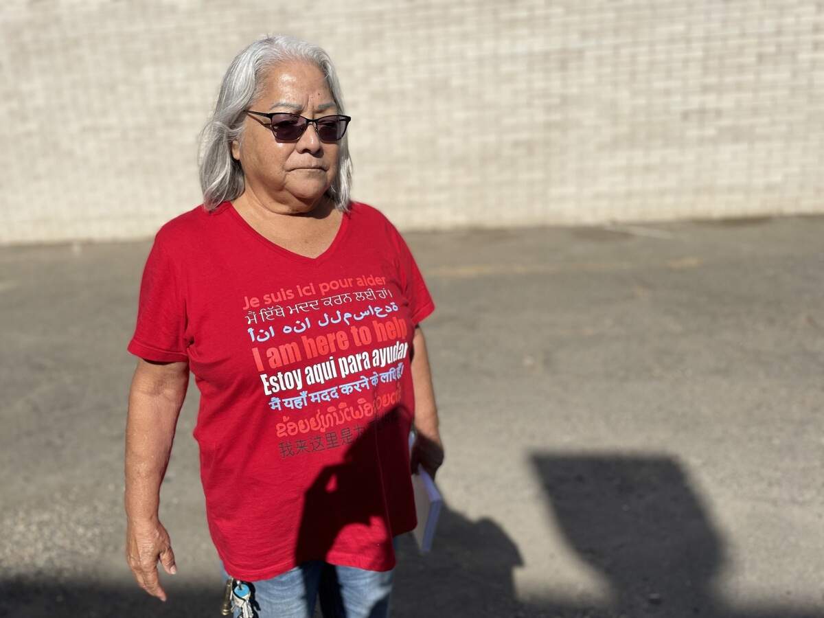 Gloria Hernandez, a volunteer with the Valley Watch Network rapid response network, wears a shirt saying “I am here to help” outside the ICE office in downtown Fresno on Tuesday, Oct. 6, 2026.