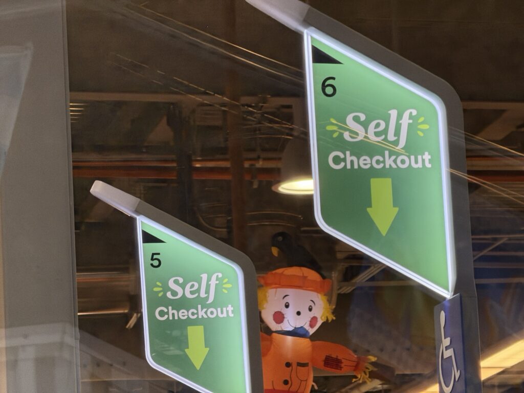 Self-checkout signs.