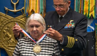 Karol McClelland, President of Coronado Rotary Club, receives a medallion during the 2026 Spirit of Hope (SoH) Award ceremony in the Pentagon Hall of Heroes in Arlington, Virginia, Sept. 23, 2026. Robert Salesses, Department of War Director of Administration and Management, hosted the event. (U.S. Army photo by Christopher Kaufmann)
