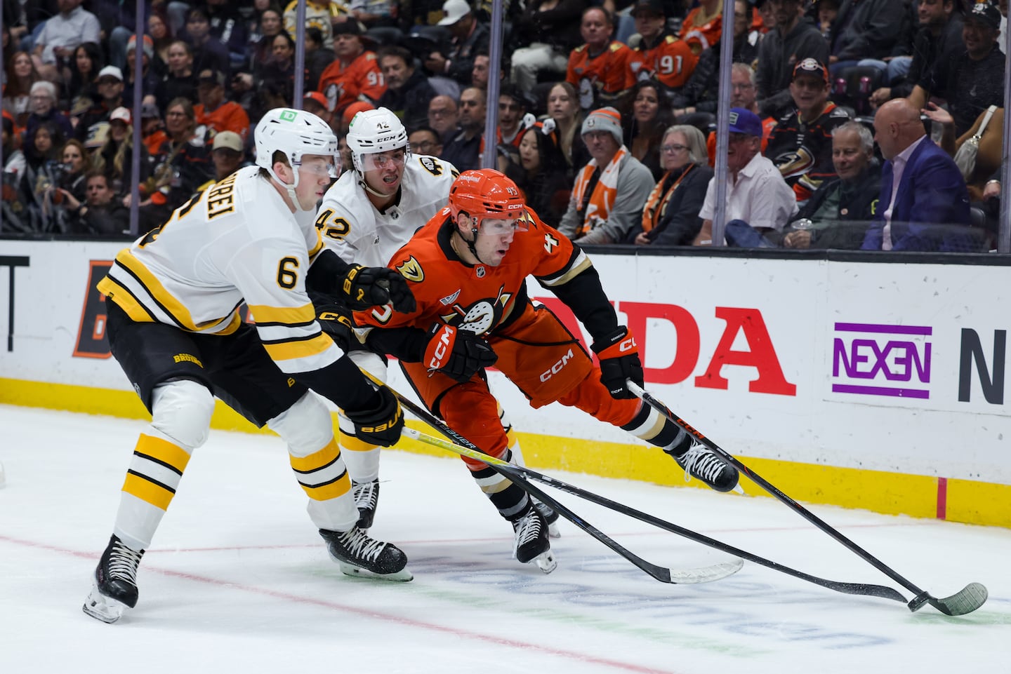 Bruins defenseman Mason Lohrei (6) made the most of his trip out West, catching his favorite baseball team post their biggest win in 44 years. 