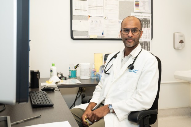 Naman Shah, an epidemiologist with the Los Angeles County Department of Public Health, is helping lead a county effort to reduce medical debt by getting hospitals to screen more patients for financial assistance. (Lauren Justice for KFF Health News and Tradeoffs)