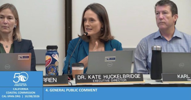 Dr. Kate Huckelbridge, executive director of the California Coastal Commission, speaks at the group's Oct. 8 meeting at the City of Oceanside Civic Center about what the CCC and the city of San Diego are doing behind the scenes to address concerns at La Jolla Cove. (Screenshot by Noah Lyons)