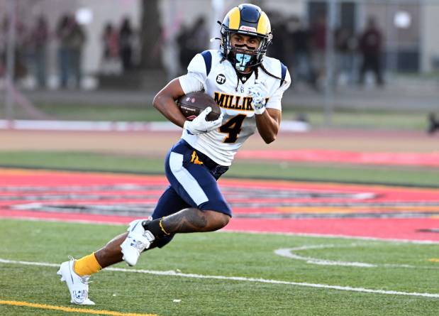 Millikan's Aden Taufa (4) returns the ball on the opening kick off in the first half of a prep football game against the Downey Vikings at Downey High School in Downey on Friday, September 4, 2026. (Photo by Libby Cline Birmingham, Contributing Photographer)