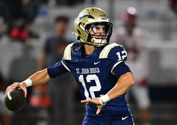 Quarterback Koa Malau'ulu #12 of St. John Bosco drops back to pass. St. John Bosco hosted Orange Lutheran in a Trinity League football game on October 8, 2026 in Bellflower, CA. (Photo by John McCoy, Contributing Photographer)
