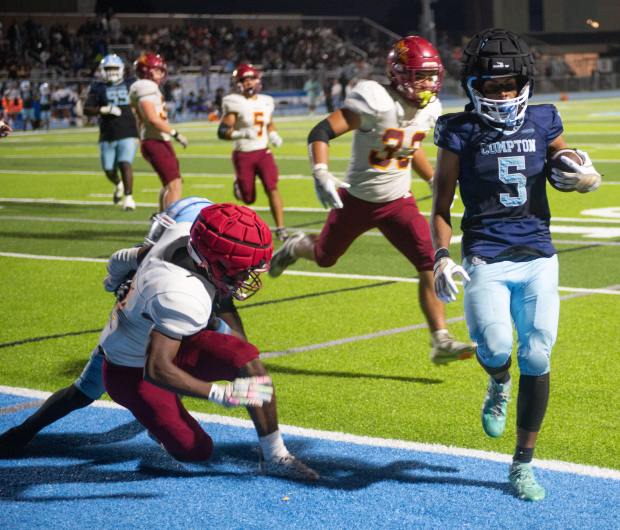 Compton's Edward Rivera runs the ball in for a touchdown during Friday's non league game against Wilson at Compton High School on Friday, September 25, 2026.
