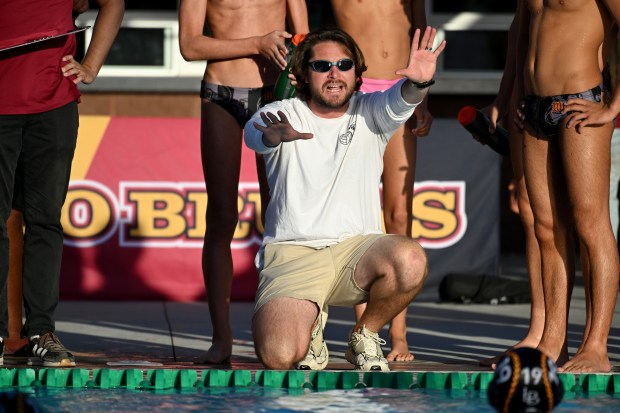 Wilson head coach coach Zac Polmanteer leads his team to a 11-6 win in a Moore League boys water polo game against Long Beach Poly on Tuesday October 13, 2026. (Photo by Axel Koester, Contributing Photographer)