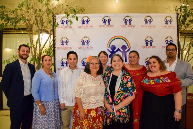 From left, Young Horizons Board of Directors board members Moustapha Hammoude, Alexandra Torres-Galancid, Frank Gutierrez, Elizabeth Willis (center back), Nancy Manriquez, Dowell & Executive Director Sarah Soriano (center), Alejandra Albarran Moses, Bianca Villanueva and Juancarlos Mariano (right) at Young Horizons's annual fiesta. (Courtesy photo)