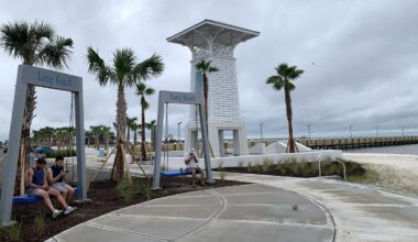Long Beach, MS, gateway opens with swings and palm trees
