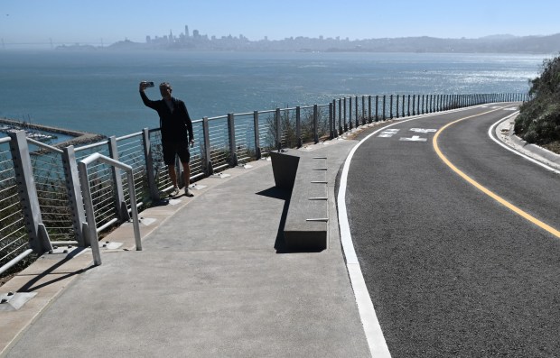 Maximo Olivas of Valencia, Spain, takes a selfie with the San Francisco skyline in the background as he visits the new Vista Point Trail in Sausalito, Calif., on Tuesday, Sept. 29, 2026. (Alan Dep/Marin Independent Journal)