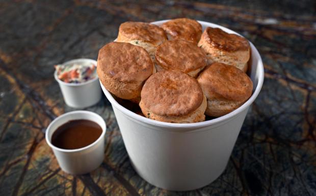 Fun Bucket, is a shareable meal including one pound of potato wedges, 8 pieces of fried chicken, 8 pieces of corn wheels, topped with a lid of fresh biscuits, served with house-made gravy and coleslaw. One of the new menu items for the 2026-27 NHL season at Honda Center in Anaheim. Tuesday September 29, 2026.(Photo by Karen Tapia, Orange County Register/SCNG)