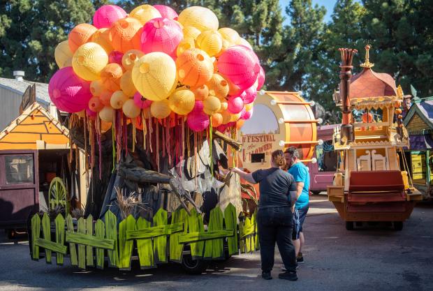 Volunteers Jonathan Maddron, right, of Anaheim and Lacie Barker of Santa Clarita work to put the finishing touches on a parade float during the final build day for the Halloween Parade floats in the 102nd Anaheim Fall Festival. (Photo by Jeff Antenore, Contributing Photographer)