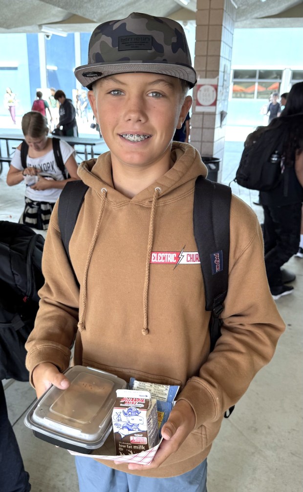 Pacific Beach Middle School seventh grader Kolton Hughes holding his lunch. (Cyril A Reinicke)