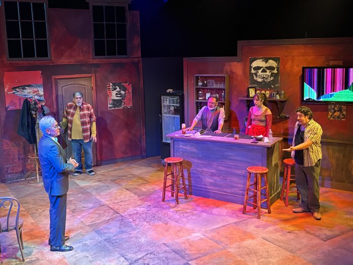 Five actors perform a tense scene inside a Boyle Heights bar in Dive Bar at CASA 0101 Theater.