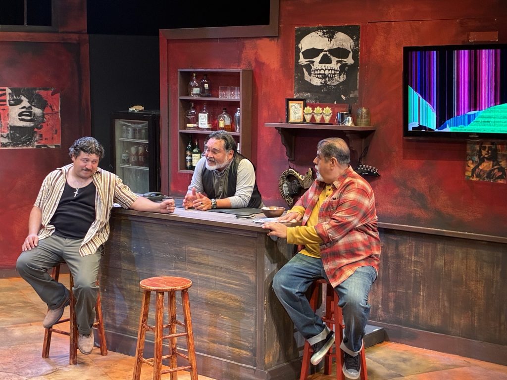 Gilbert Reynoso, Martín Morales and Oscar T. Basulto perform a bar scene in Dive Bar at CASA 0101 Theater.