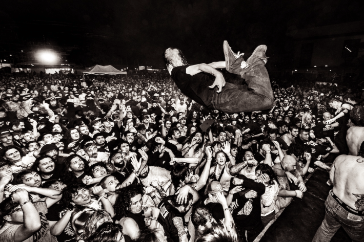 a singer jumps off the stage into the crowd