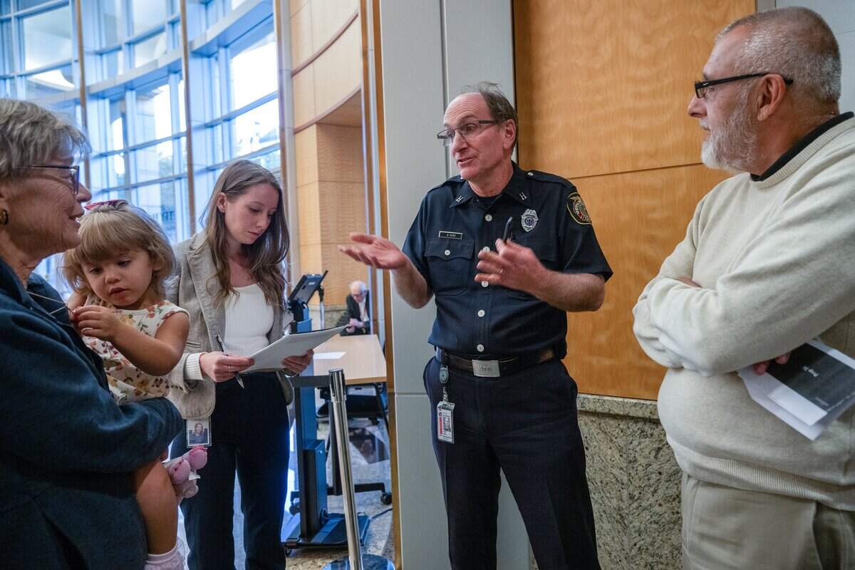 Sacramento Fire Capt. Brian Morr offers to help find Califia Carlisle after listening to Anne Marie Carlisle, far left, and Christopher Carlisle, right, after a City Council behavioral health workshop on Tuesday. Morr, who read about Califia and her boyfriend, Justin, in a series by The Sacramento Bee, said he believes he may be able to help them.