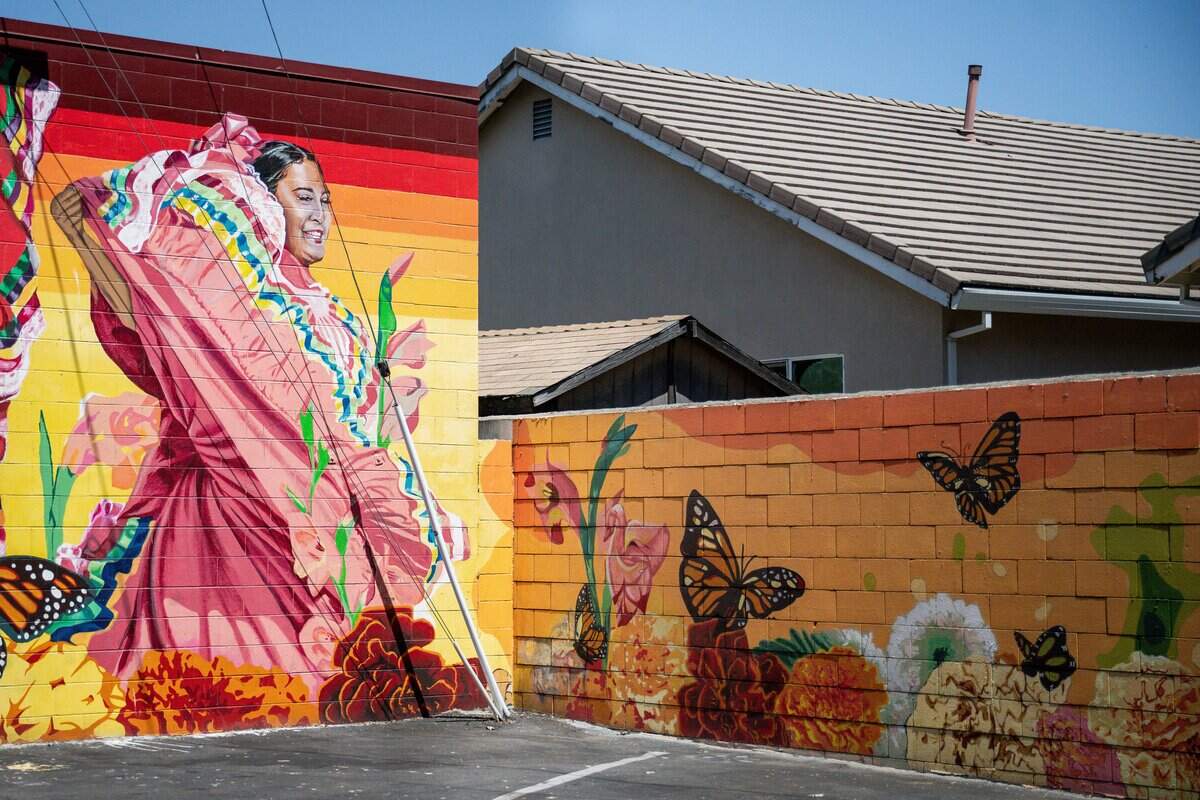 The “Rhythm and Victory” mural by Beth Consetta Rubel at Taco Plaza in Sacramento celebrates the diverse Northgate community.