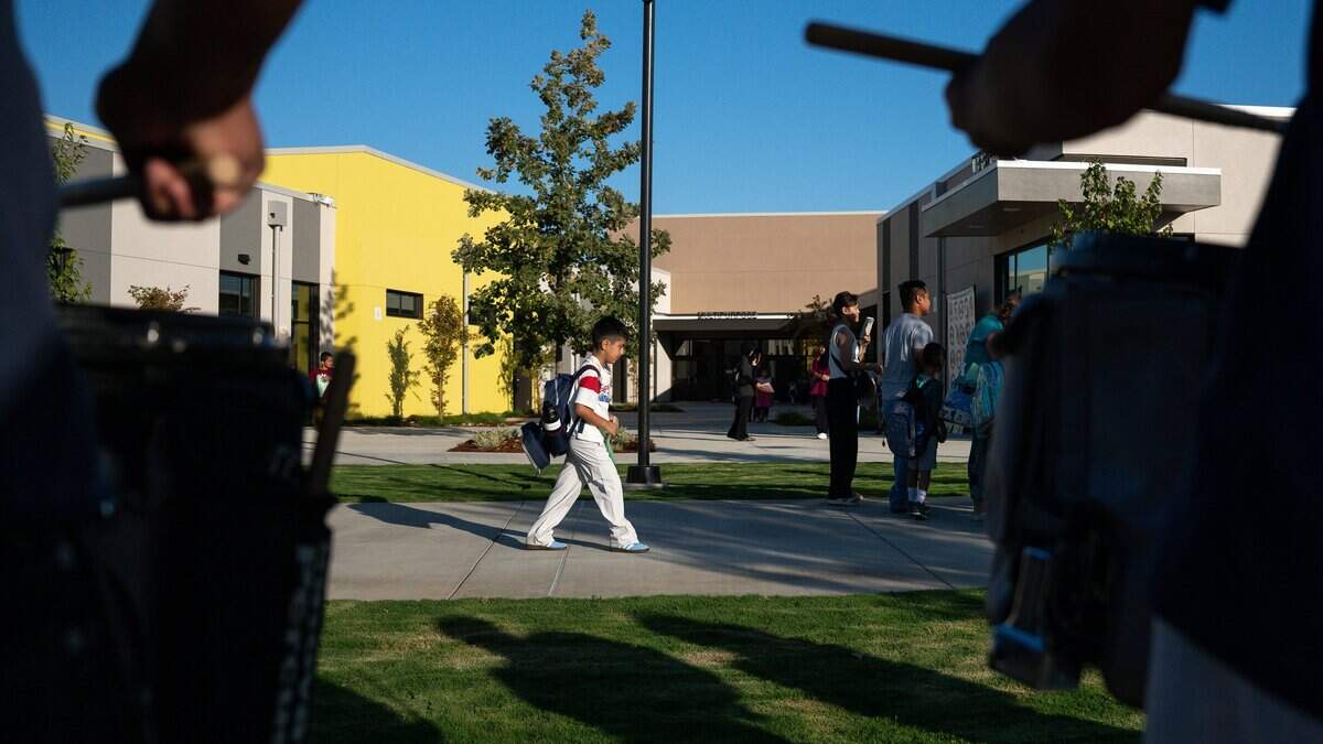 A student walks to a classroom during Winding Creek Elementary's opening day in Roseville in August.
