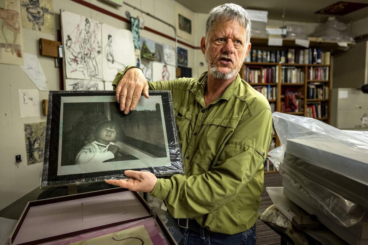 Sacramento novelist and journalist William T. Vollmann holds a gum bichromate print of his late daughter Lisa at his studio in September.