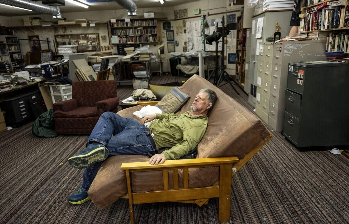 Sacramento novelist and journalist William T. Vollmann rests at his Sacramento studio in September.