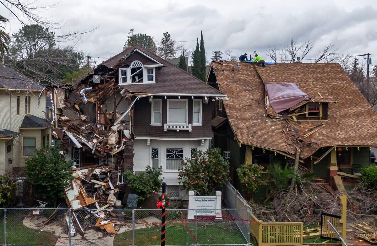 Extensively damaged homes stand on the 2600 block of Capitol Avenue in Sacramento on Jan. 10, 2023, after a powerful storm.