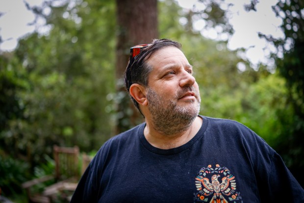 David Collins, 53, looks at the trees in Woodside, Calif., on Thursday, Sept. 17, 2026. Collins, an electrician, is a 5th-generation Californian who is considering moving because of affordability. (Shae Hammond/Bay Area News Group)