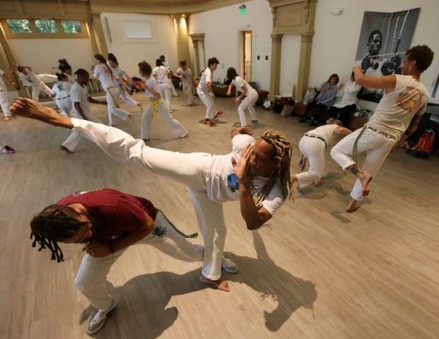 Jervani Thompson, center, takes part in the Festa Da Capoeira event on Sunday, Sept. 20, 2026, in Oakland, Calif. (Aric Crabb/Bay Area News Group)