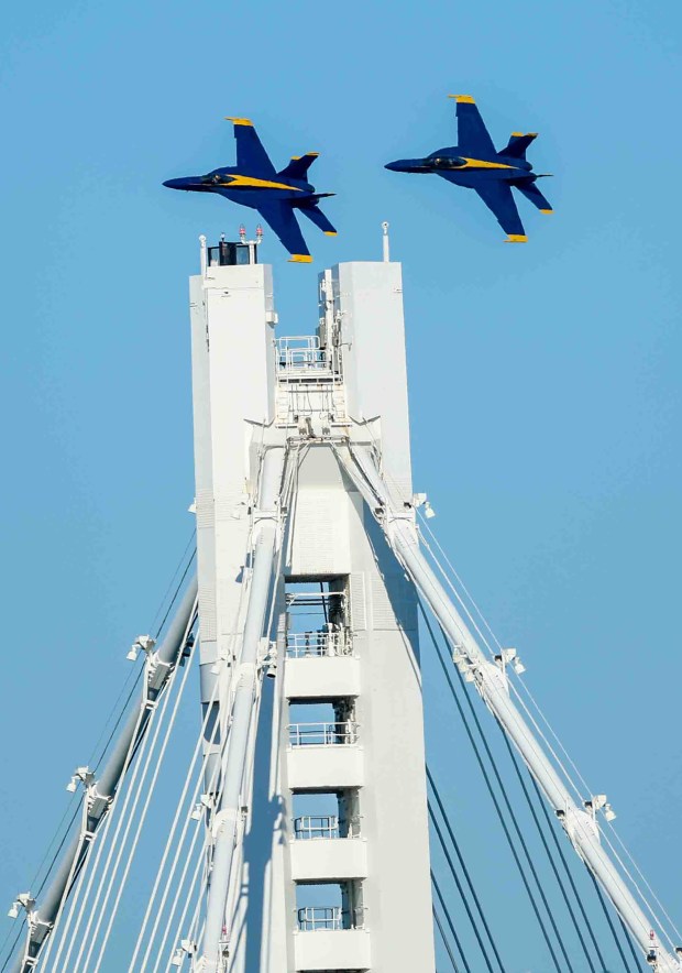 The U.S. Navy Blue Angels fly over the Bay Bridge and the San Francisco Bay during a practice flight for San Francisco Fleet Week, as seen from Treasure Island in San Francisco, Calif., on Thursday, Oct. 8, 2026. (Ray Chavez/Bay Area News Group)