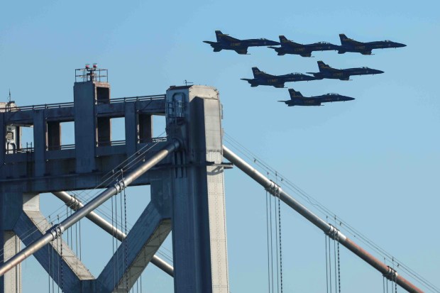 The U.S. Navy Blue Angels fly over the Bay Bridge and the San Francisco Bay during a practice flight for San Francisco Fleet Week, as seen from Treasure Island in San Francisco, Calif., on Thursday, Oct. 8, 2026. (Ray Chavez/Bay Area News Group)