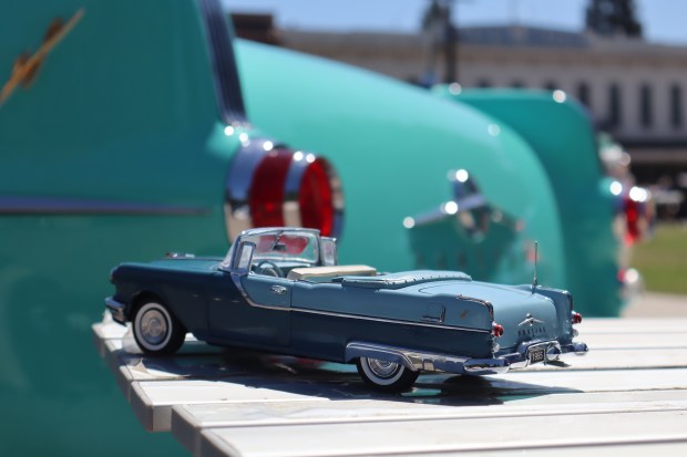 A 1955 Pontiac Star Chief in miniature size, compared to it's full sized companion, at the 26th annual Cars in the Park at History Park in San Jose, Calif., on Saturday, September 12, 2026. (Kaitan Pawar/Mosaic)