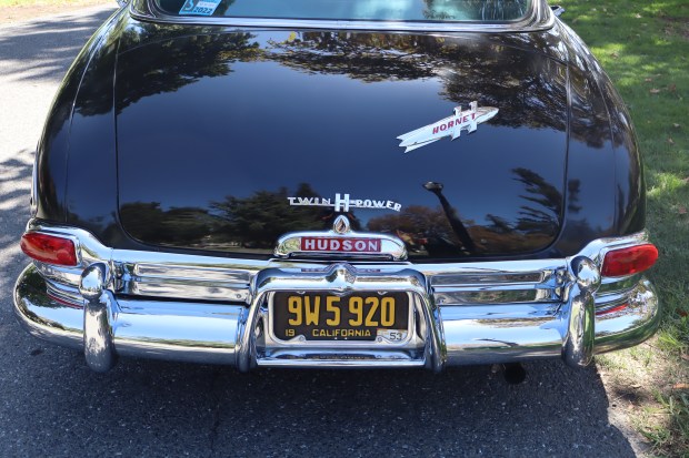 The iconic badge and chrome tips of a 1953 Hudson Hornet, at the 26th annual Cars in the Park at History Park in San Jose, Calif., on Saturday, September 12, 2026. (Kaitan Pawar/Mosaic)