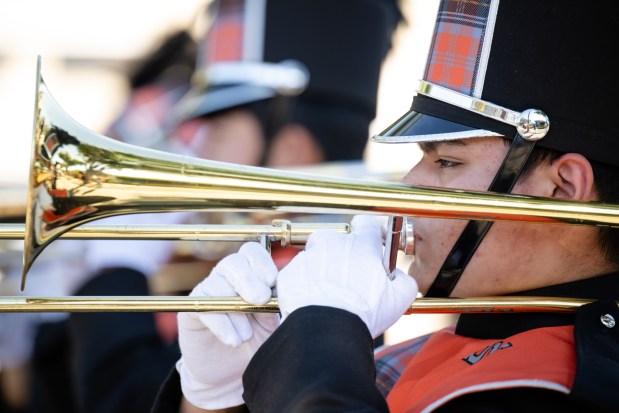 A San Mateo High School marching band trombonist warms up before the 57th Santa Clara Parade of Champions in Santa Clara, Calif., on Saturday, Oct. 3, 2026. (Thien-An Truong for Bay Area News Group)