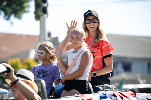 Leslie Osborne, retired U.S. Women's National Team player and co-founder of Bay FC, waves during the 57th Santa Clara Parade of Champions in Santa Clara, Calif., on Saturday, Oct. 3, 2026. (Thien-An Truong for Bay Area News Group)