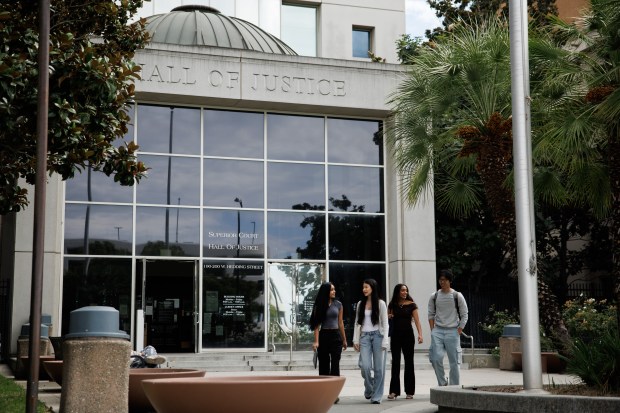 Evergreen Valley High School student Ariana Corbu, 17, second from left, and Leland High School students Ishani Manral, 17, far left, Apurva Tadimeti, 17, third from left, and Ian Gao, 17, right, leave the Hall of Justice after observing a court proceeding on Aug. 28, 2026, in San Jose, Calif. They are members of Justice For All, a student-led court-watching nonprofit that aspires to keep an eye on equity and fairness in everyday court proceedings. (Dai Sugano/Bay Area News Group)