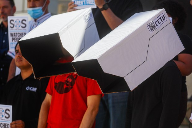 People wearing camera masks protest Flock cameras at San Jose City Hall in downtown San Jose, Calif., on Wednesday, Sept. 30, 2026. (Shae Hammond/Bay Area News Group)