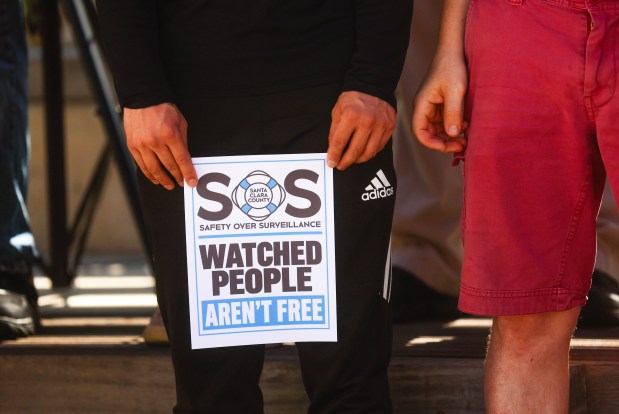 A person holds a sign at a Flock camera protest at San Jose City Hall in downtown San Jose, Calif., on Wednesday, Sept. 30, 2026. (Shae Hammond/Bay Area News Group)
