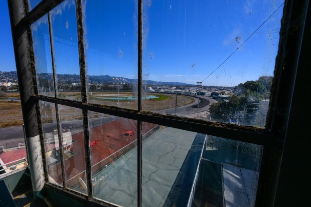 Spiderwebs adorn a large glass window that looks out onto the race track during a site tour of the Golden Gate Fields in Albany, Calif., on Monday, Oct. 5, 2026. The historic horse racing track closed in 2024 after 83 years of racing and will be converted into a new bayfront public park. (Jose Carlos Fajardo/Bay Area News Group)