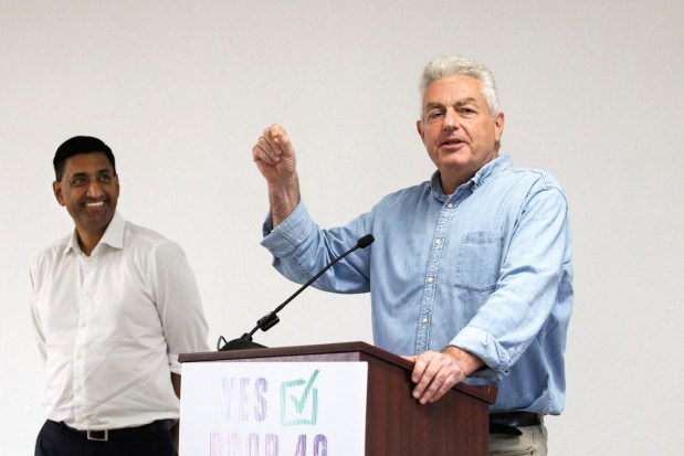 U.S. Rep. Ro Khanna (D-Calif.), left, listens as SEIU-United Healthcare Workers West President Dave Regan speaks during a rally for Prop 40, also known as the "Billionaire Tax," at the South Bay Labor Council headquarters on Aug. 18, 2026, in San Jose, Calif. (Dai Sugano/Bay Area News Group)
