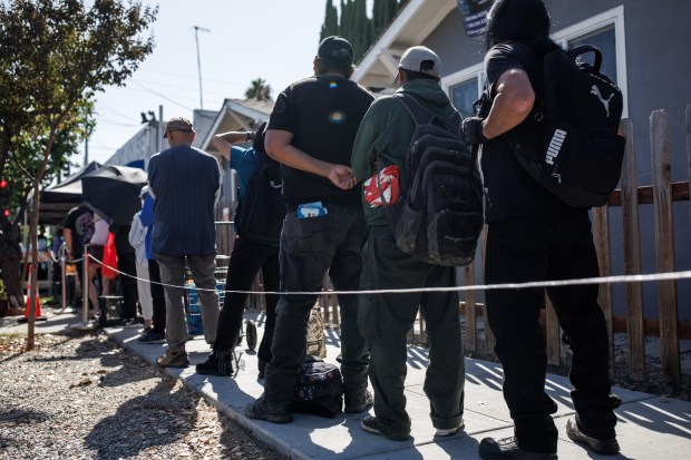 People wait in line to receive free food at Lighthouse Food Rescue & Distribution in San Jose, Calif., on Oct. 12, 2026. (Dai Sugano/Bay Area News Group)