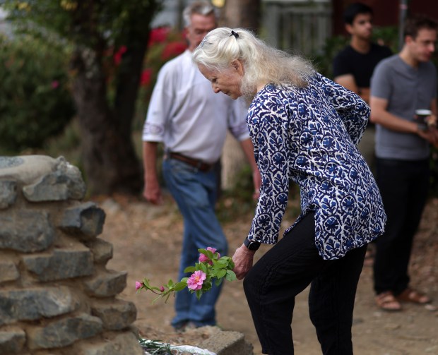Neighbors take part in a community gathering on Sunday, Oct. 4, 2026 in Oakland, Calif. Over 40 community members gathered in the Oakland hills above the campus of UC Berkeley to remember their neighbors Bryan Walker and his wife Michelle Min who were shot and killed on Friday. (Aric Crabb/Bay Area News Group)