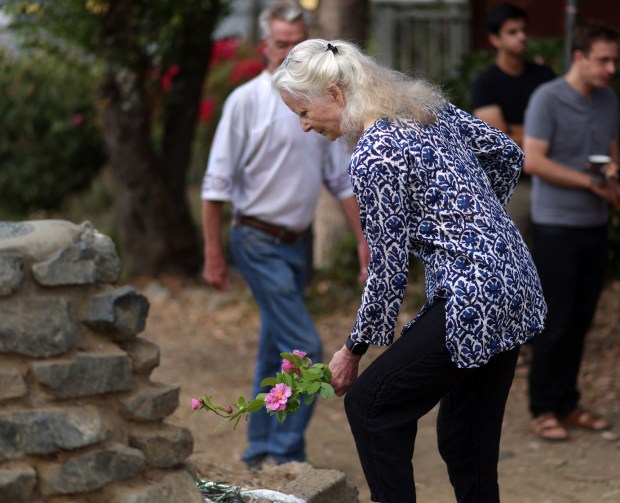 Neighbors take part in a community gathering on Sunday, Oct. 4, 2026 in Oakland, Calif. Over 40 community members gathered in the Oakland hills above the campus of UC Berkeley to remember their neighbors Bryan Walker and his wife Michelle Min who were shot and killed on Friday. (Aric Crabb/Bay Area News Group)