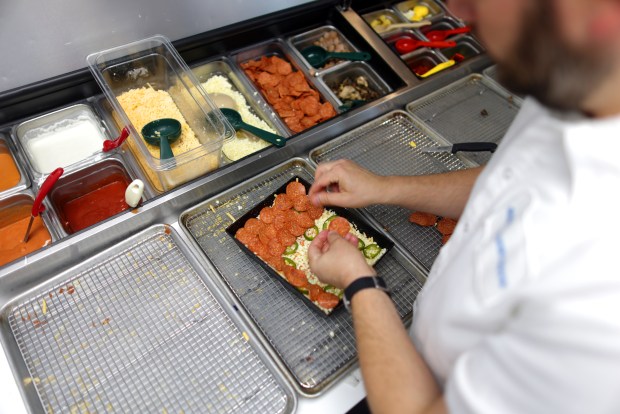 Square Pie Guys founder Marc Schechter makes Spicy Pepperoni pizza in his Walnut Creek restaurant on Sept. 22, 2026. (Aric Crabb/Bay Area News Group)